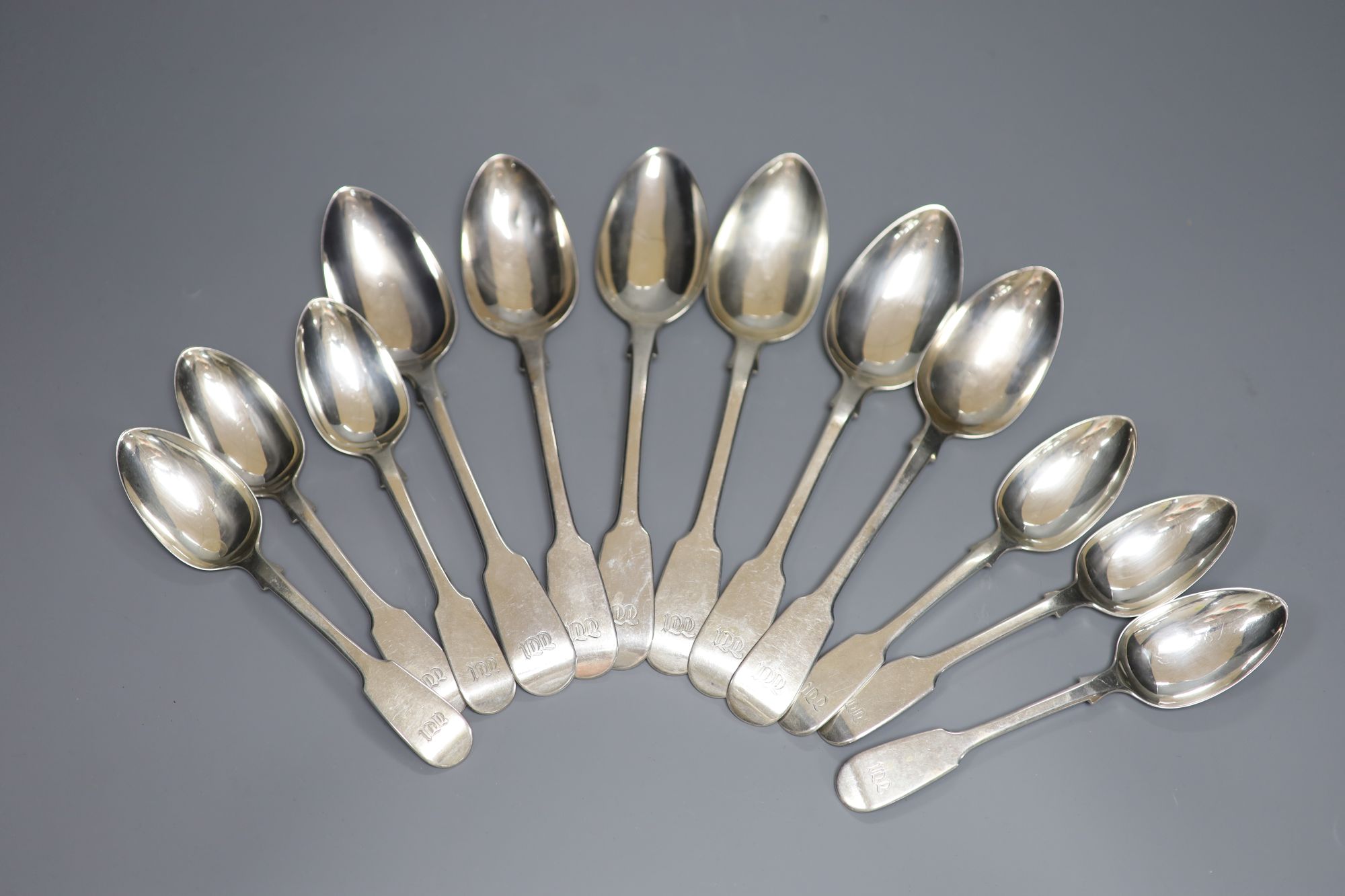 A set of six early Victorian silver fiddle pattern table spoons and six dessert spoons, James Beebe, London, 1846, 21.8oz.